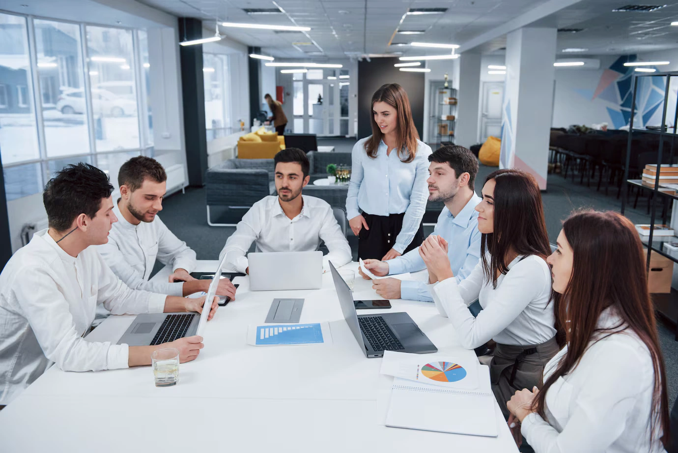 guy left side talking colleagues
