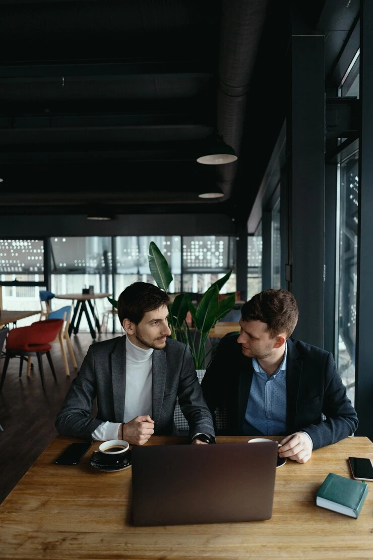2 men in a meeting